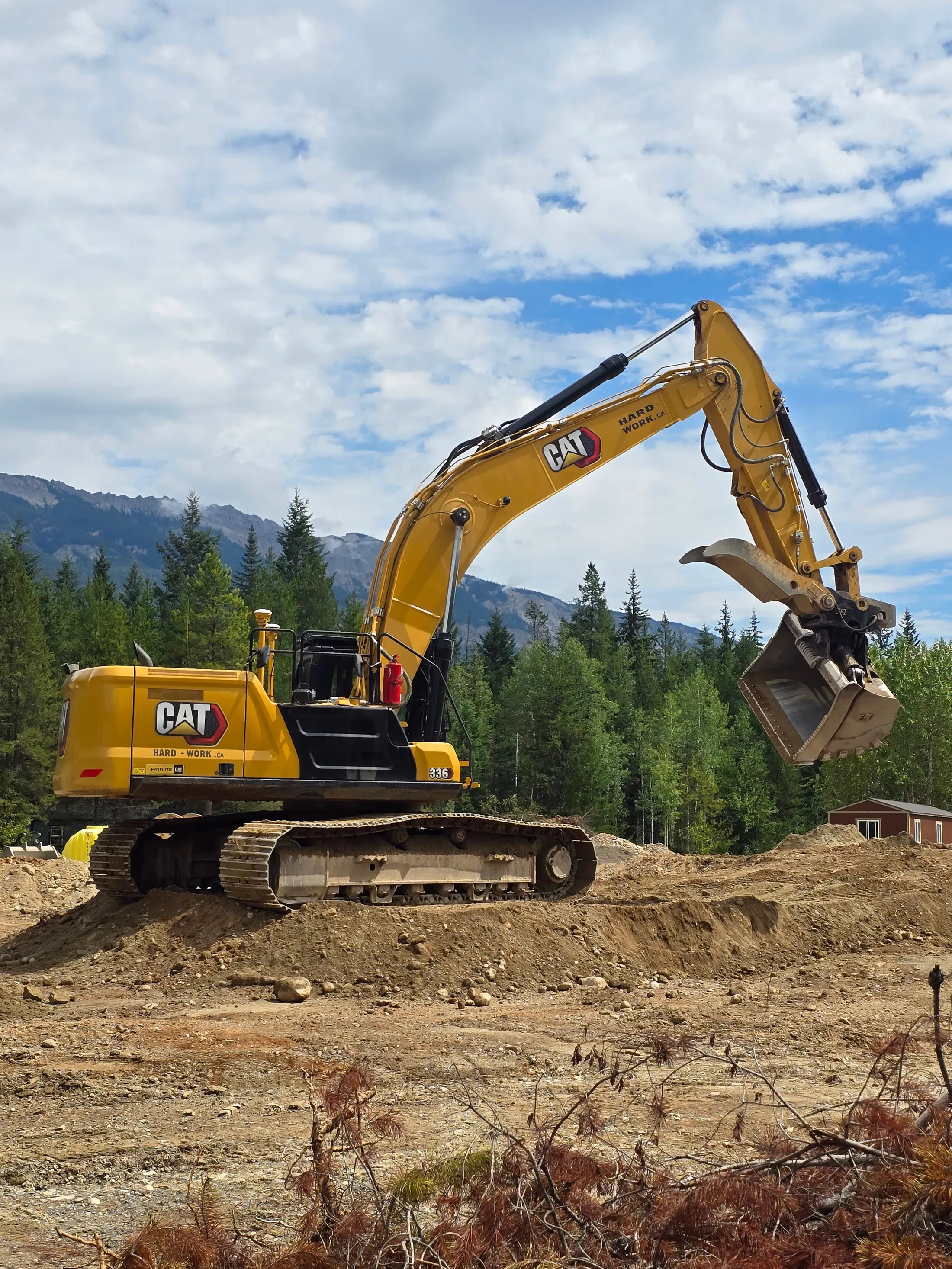 A GPS-guided excavator at work on a Hard Work Industries earthworks site